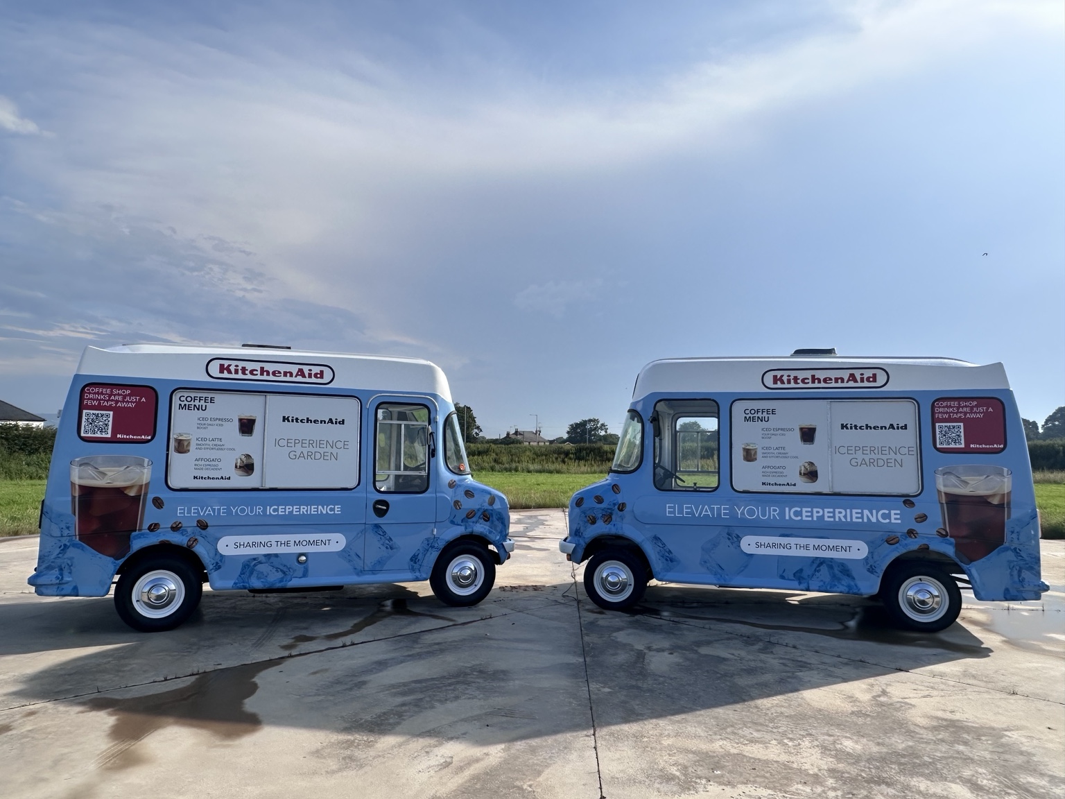 Side profile of two Bedford CF vans in matching campaign wraps